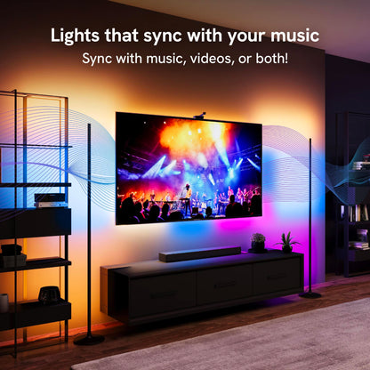 Two floor lamps and tv backlight unit syncing to a music concert on the tv screen.